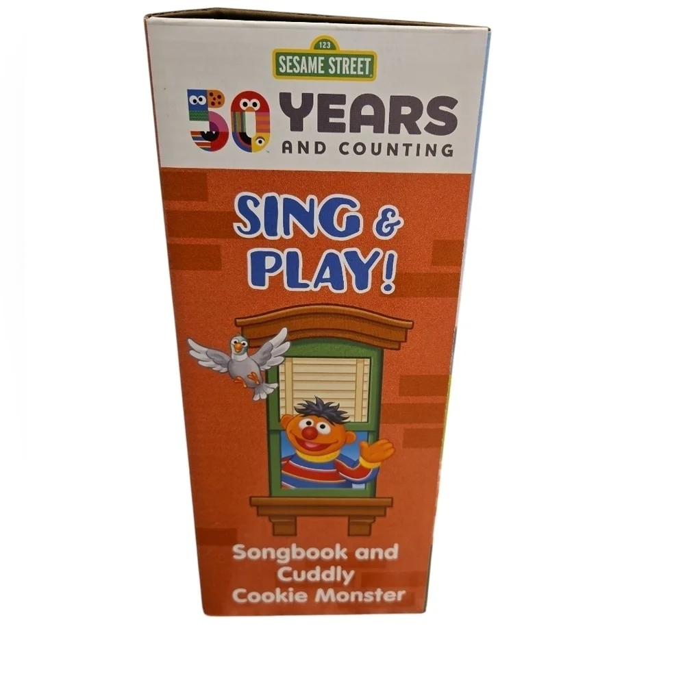 SING AND PLAY SONGBOOK AND CUDDLY COOKIE MONSTER. NEW IN BOX.